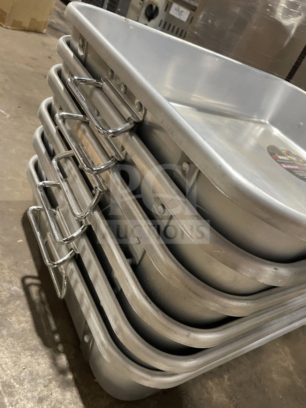 Brand new Winco ALRP-1824 heavy-duty double roaster with straps and handles, stacked, commercial-grade condition.