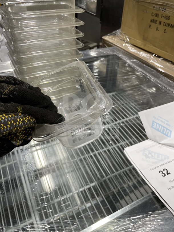 Thunder Group PLPA8192 polycarbonate food pan. Stack of clear pans, durable commercial-grade, good condition.