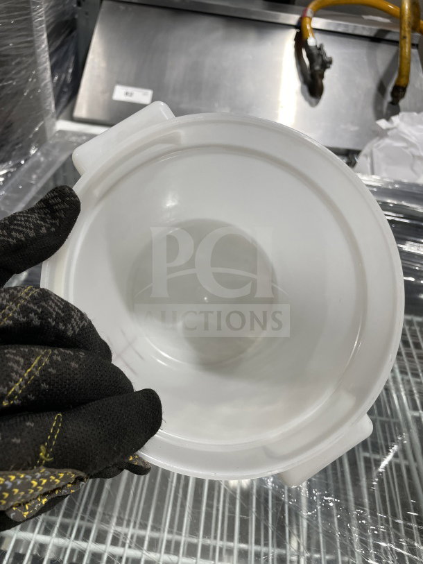 Translucent 4 Qt. round food storage container with red graduation marking, used condition, durable commercial-grade plastic.