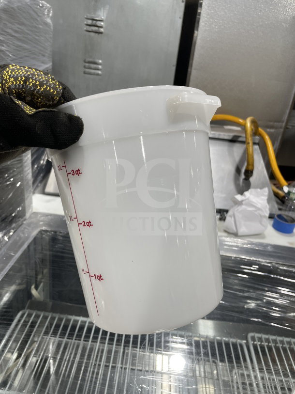 Commercial 4 Qt. translucent round food storage container with red graduation markings, in new condition.