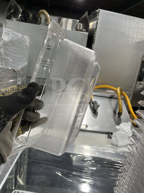 Rubbermaid Commercial Clear Polycarbonate Deep Food Pan, Model 3396, shown in excellent condition, held for scale.