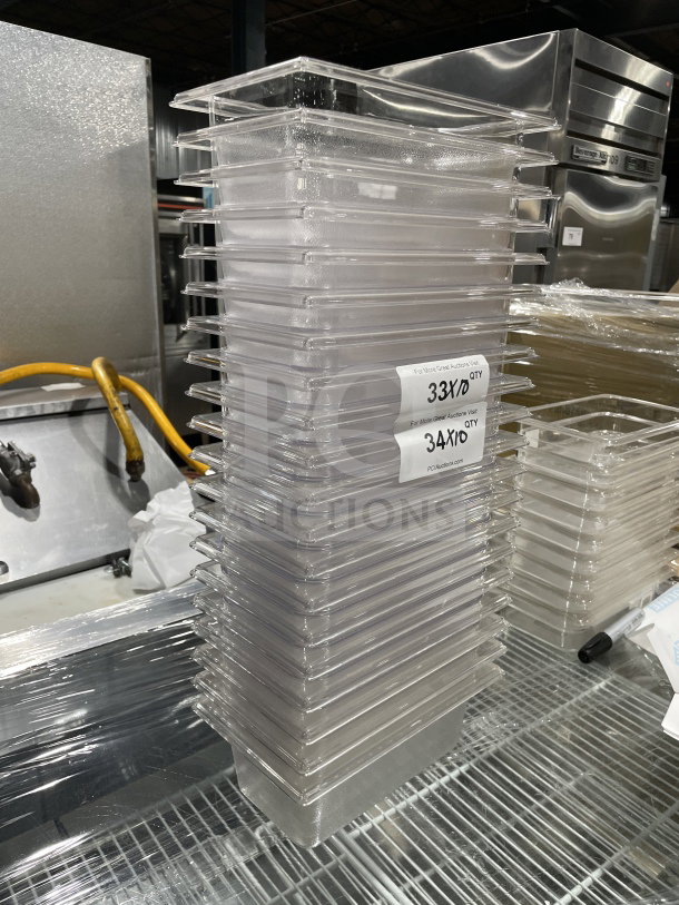 Rubbermaid Commercial Clear Polycarbonate Deep Food Pan, Model 3396. Stack of multiple pans in new condition.