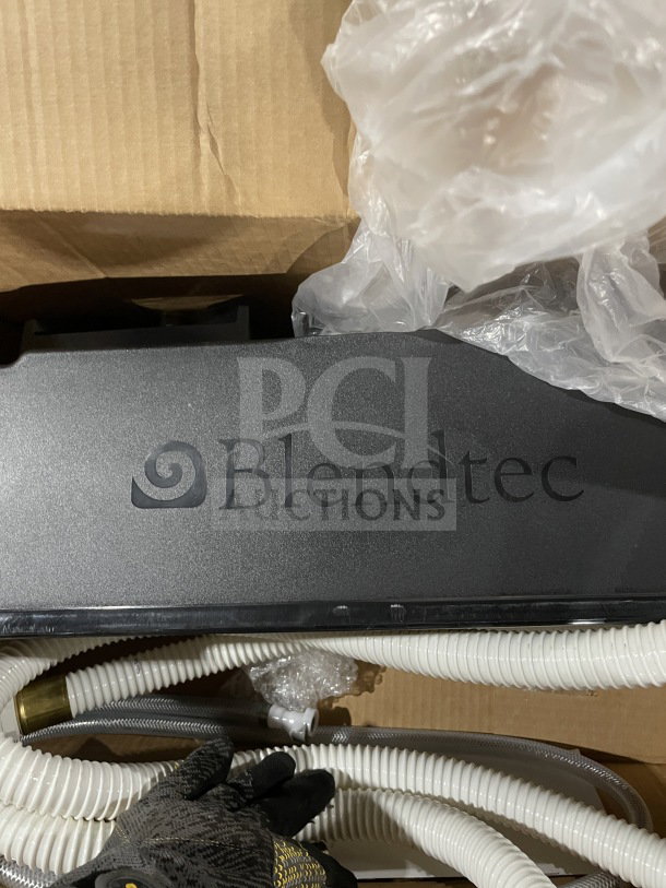 New Blendtec RRS Rapid Rinser Commercial Station in box, with sprayer, base, flexible tubing. Brand logo visible.