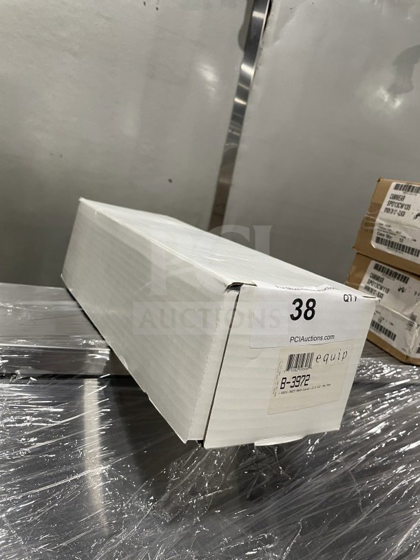Brand new T&S 3.5" commercial sink lever waste valve, Model B3972, in sealed box with label displaying model and serial number.