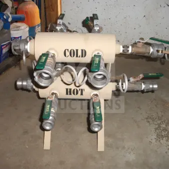 BRAND NEW Military Outdoor Water Manifold with green-handled quarter-turn ball valves. Labels indicate "COLD" and "HOT."