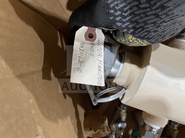 Brand new military water manifold with green-handled quarter-turn ball valves. Includes tag reading "Water Manifold, 937-162-16."