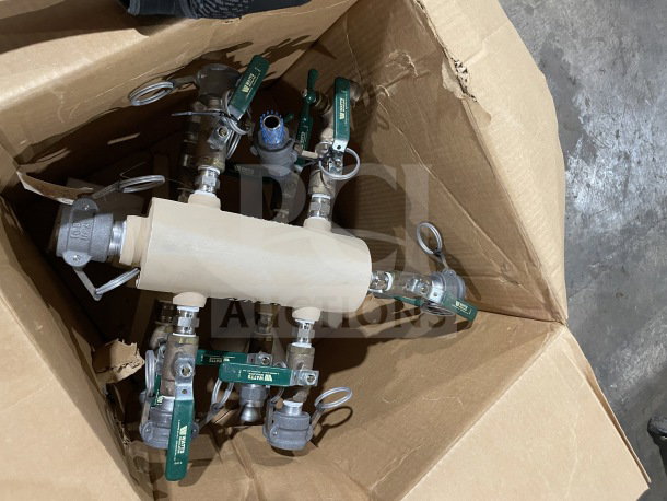Brand new military water manifold with green-handled quarter-turn ball valves, in a cardboard box. Ideal for outdoor use.