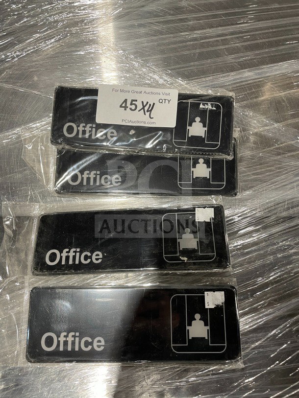 Four Thunder Group commercial office signs, new condition, black with white "Office" text and pictogram, wrapped in plastic.