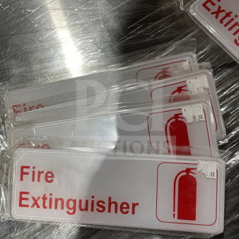 Brand new Thunder Group commercial fire extinguisher signs, red text and icon on white plastic, packaged individually.