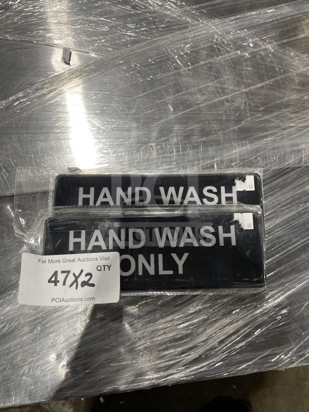 Brand new Thunder Group hand wash signs, set of two, in original packaging. Black background with white text.