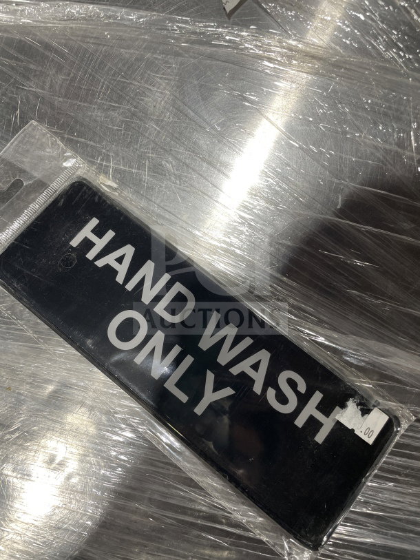 Brand new Thunder Group hand washing sign, black with "HAND WASH ONLY" text, sealed in packaging.