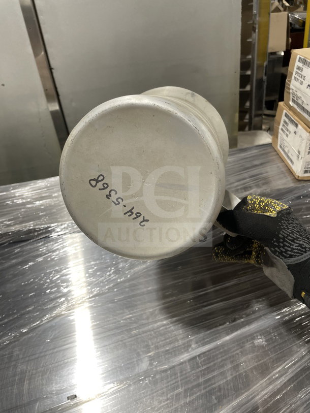 "New stainless steel liquid measuring cup, commercial surplus, base marked '246-5368', shiny finish, pristine condition."