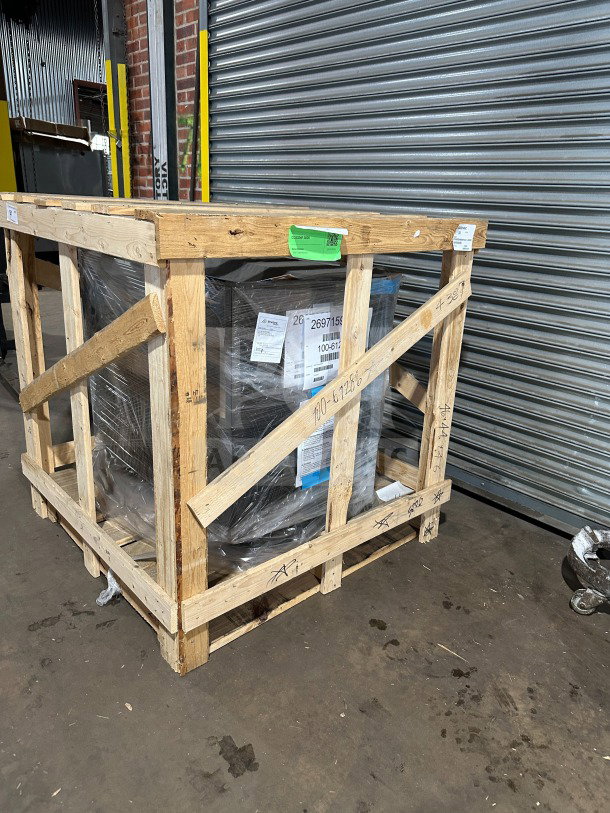 New Structural Concepts Oasis CO3324RUC refrigerated merchandiser in wooden crate. Tags indicate electrical powering.