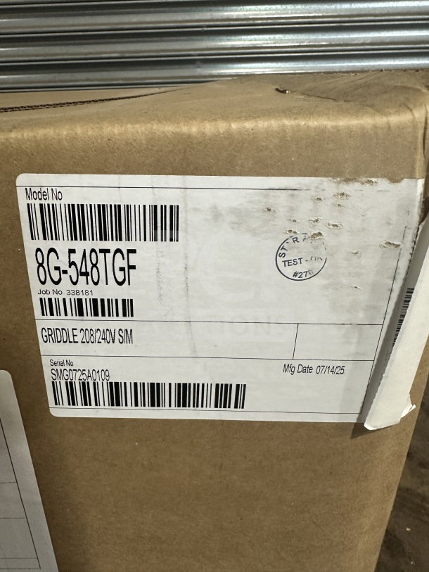 Brand new Star-Max Series 48" electric griddle, model 8G-548TGF, with snap-action controls. Serial no. SMG0725A0109, 208V/240V. Box label visible.