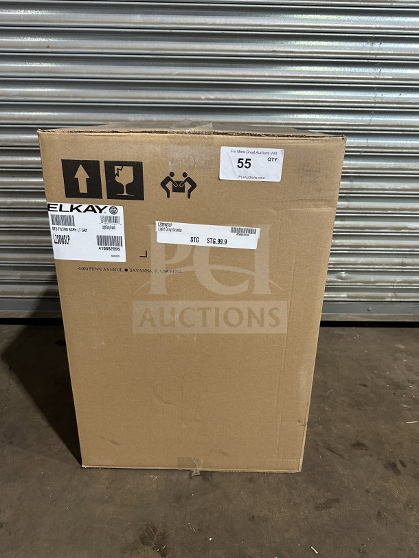 Brand new Elkay LZS8WSLP hydration station in box. Light gray granite finish. Model and serial number visible.