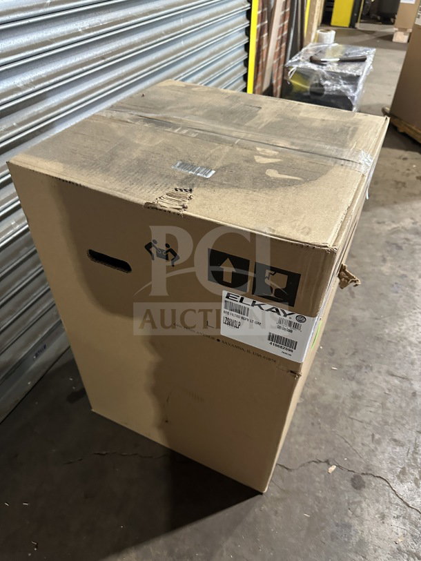 Elkay LZS8WSLP hydration station in box. Light gray granite, stainless steel cooler, touchless. 115V, SN: 410682596.
