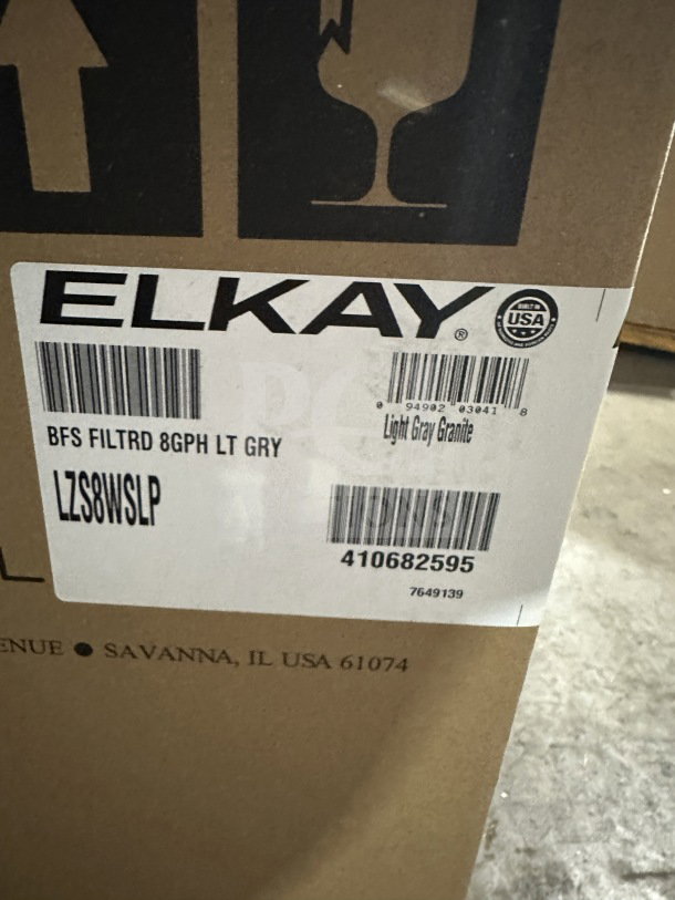 Elkay LZS8WSLP light gray granite hydration station in box. Features stainless steel cooler, touchless design. New condition.
