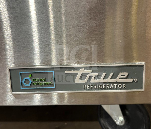 True 3-Door Stainless Steel Undercounter Refrigerator, Model TUC-72-HC, with poly-coated rack, on casters, new condition.