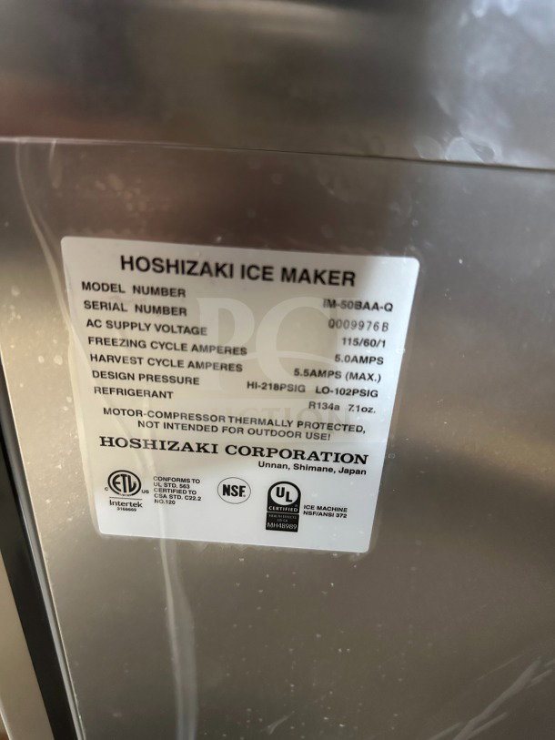 Hoshizaki IM-50BAA-Q ice maker label showing model and serial number, voltage, amps, and safety certifications.