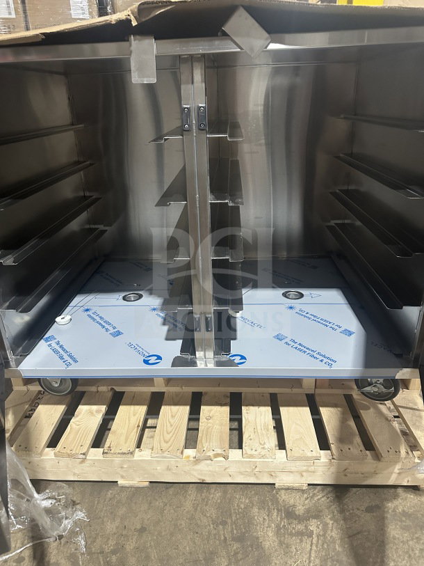 Dinex DXPICT202D stainless steel 2-door meal delivery cart, 24-tray capacity, new condition, with pan holding slides, on casters.