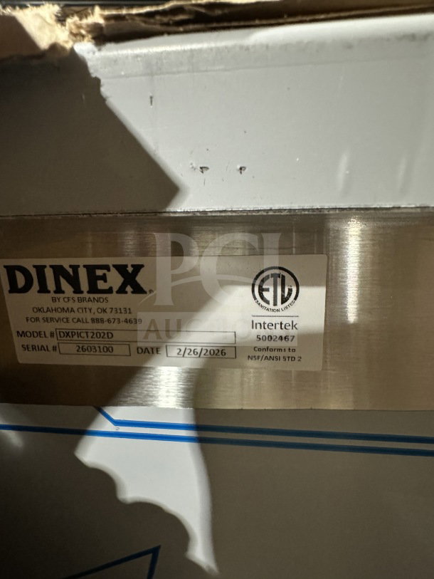 Dinex stainless steel 2-door 24-tray meal delivery cart, model DXPICT202D, SN 2603100, ETL certified, on casters, new condition.