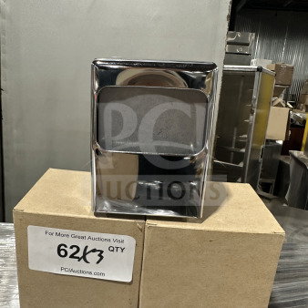 Brand new commercial chrome tabletop tallfold napkin dispenser, shiny finish, pictured atop cardboard boxes with a label.