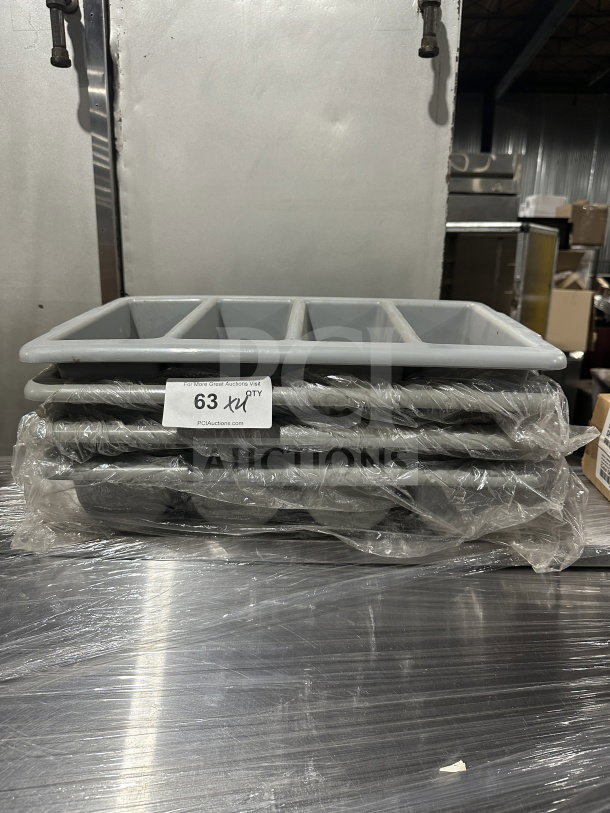 Brand new gray polyethylene 4-compartment cutlery box set. Stack of four wrapped in plastic for auction.
