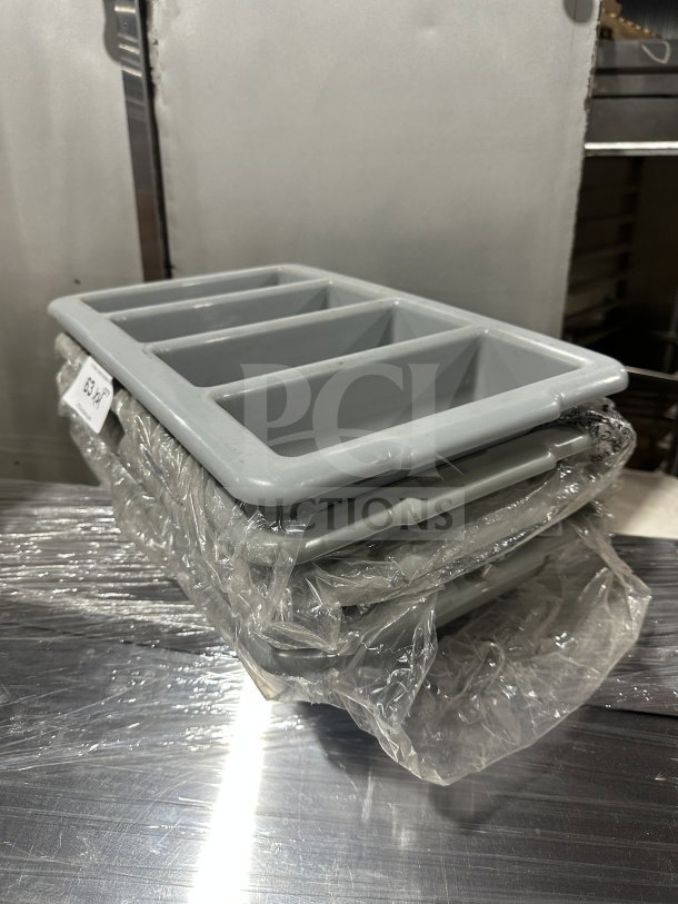 Brand new gray polyethylene 4-compartment flatware box, wrapped in plastic, label visible.