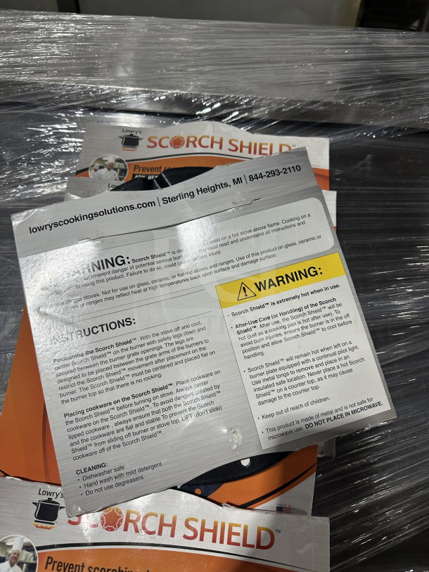 Brand new Lowry Scorch Shield, prevents scorching, burning, and boil-overs. Heavier steel construction. Includes instructions and warnings.