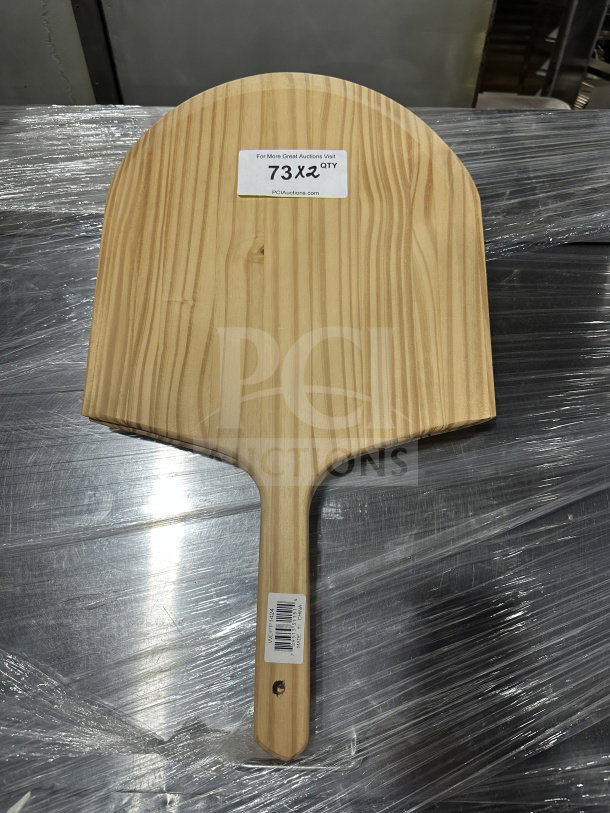 Winco wooden pizza peel, model WPP-1424, with 9" handle, in new condition. Label shows quantity and auction website.