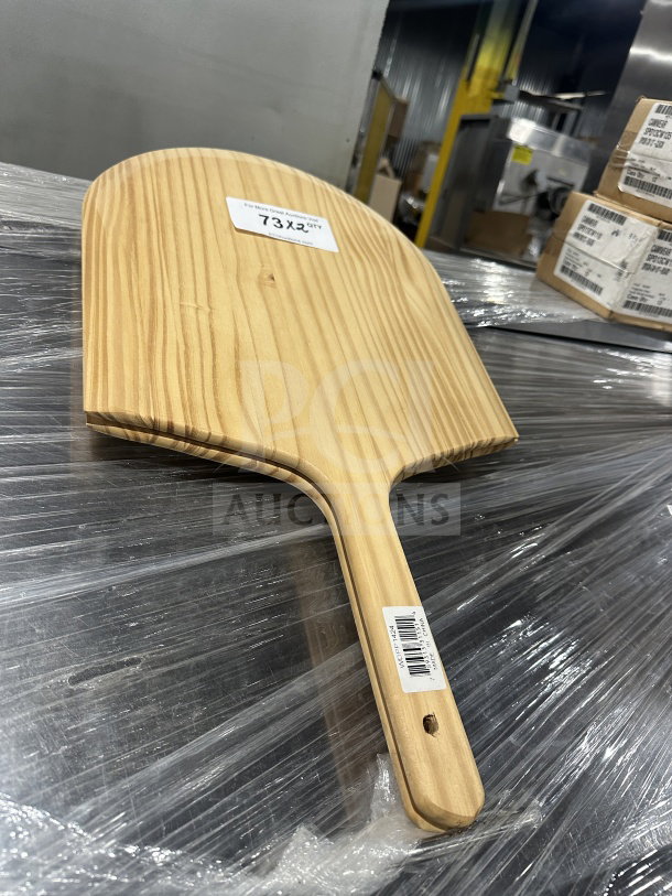 Winco wooden pizza peel, model WPP-1424, new condition, features 9" handle, label shows quantity info.