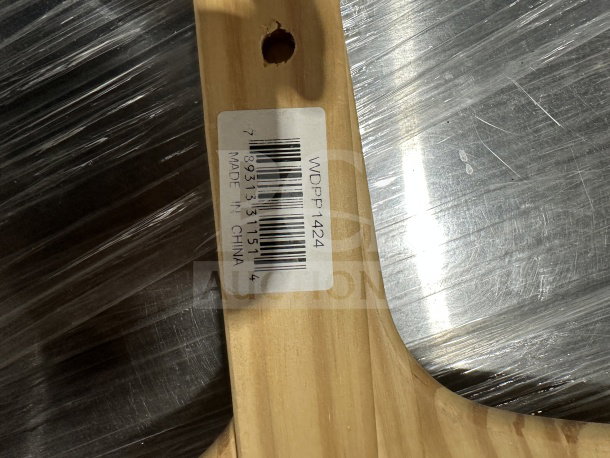 Winco wooden pizza peel, model WPP-1424, new condition, with 9" handle. Label: "Made in China."