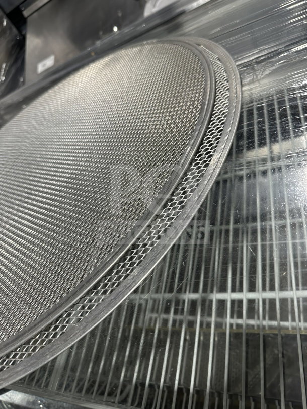 New commercial stainless steel pizza screen, durable mesh design, pristine condition, enhances even baking results.