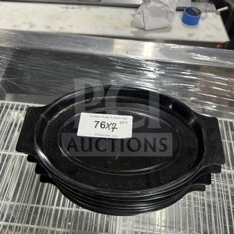 Oval black Bakelite thermal underliner with handles, good condition, stack of 7, label indicates auction quantity.