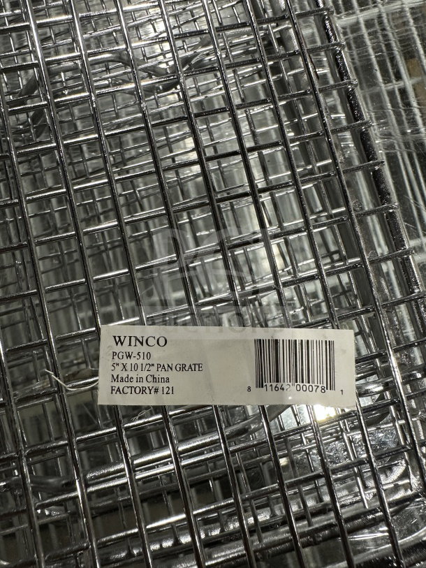 Winco chrome plated pan grate, model PGW-510, measuring 5"x10.5". New condition, factory tag visible.