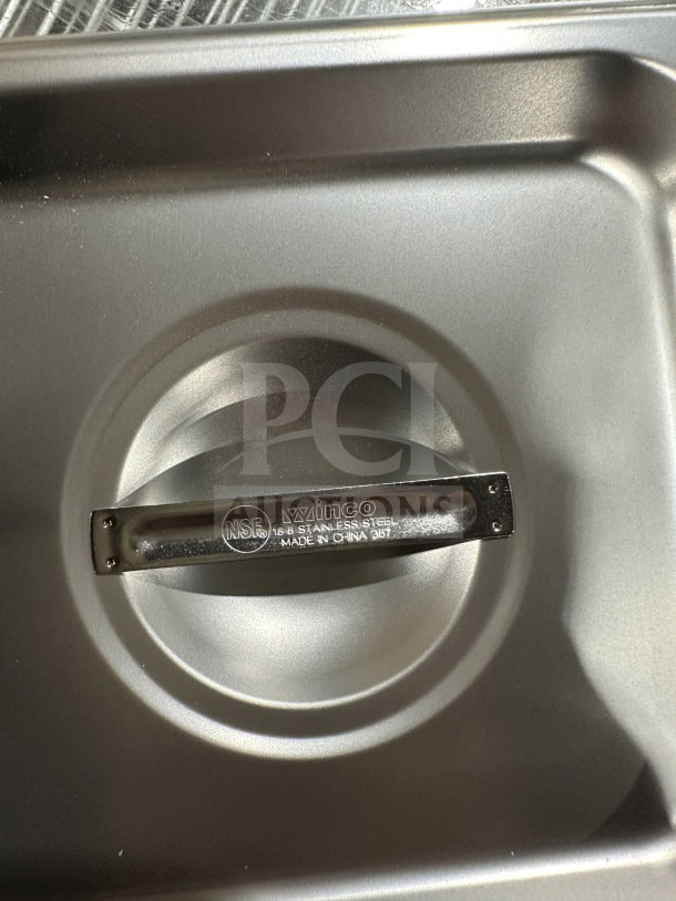 Brand new Winco SPSCS stainless steel steam table pan cover, 1/6 size, with NSR marking. Made in China.