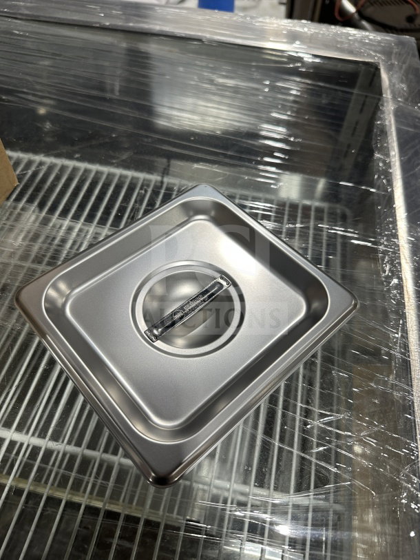 Brand new Winco SPSCS stainless steel steam table pan cover, 1/6 size, solid design, durable handle.