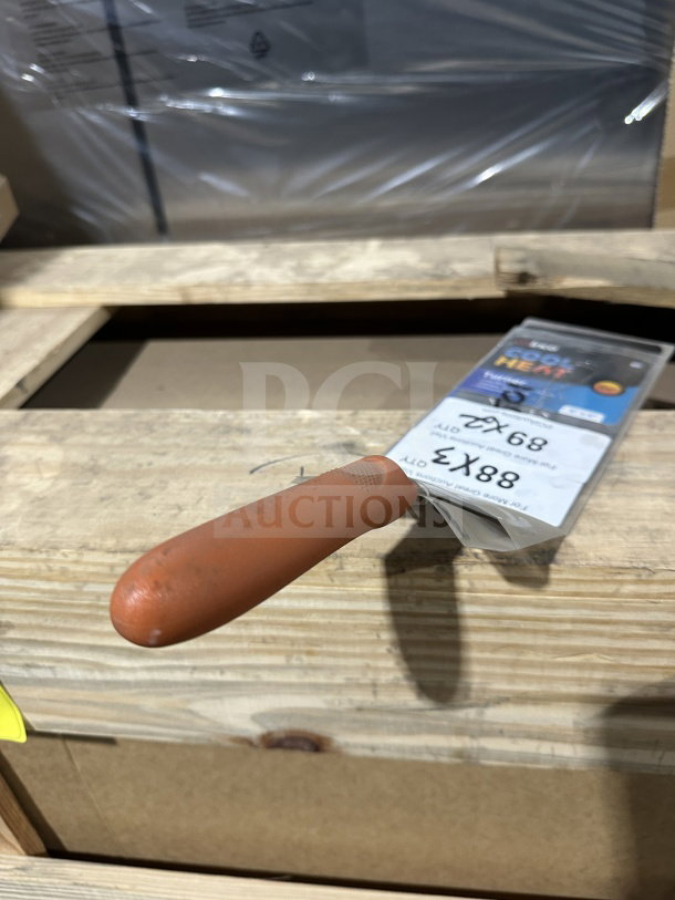 Winco TNH-42 stainless steel offset turner with orange Cool Heat handle, new condition, commercial 8"x4" size.