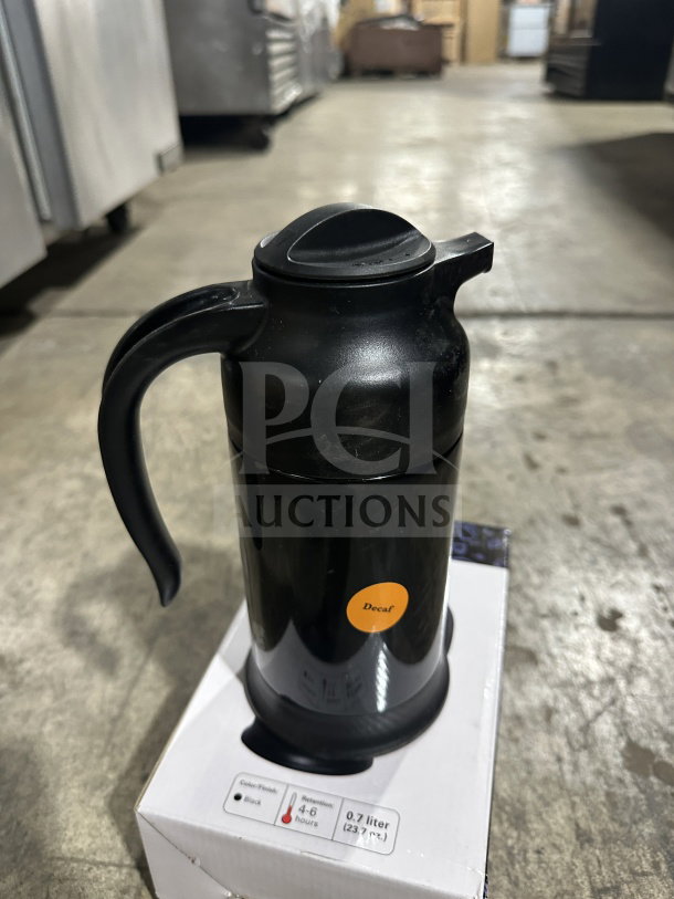 Brand new Service Ideas SteelVac Series beverage server, 0.7L, black, labeled "Decaf." Ideal for commercial use.