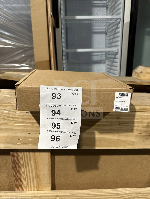 Brown shipping box for C'EST MA MAUVEL Commercial Bronze Round Pan with 2 handles, brand new, shown on a wooden shelf.