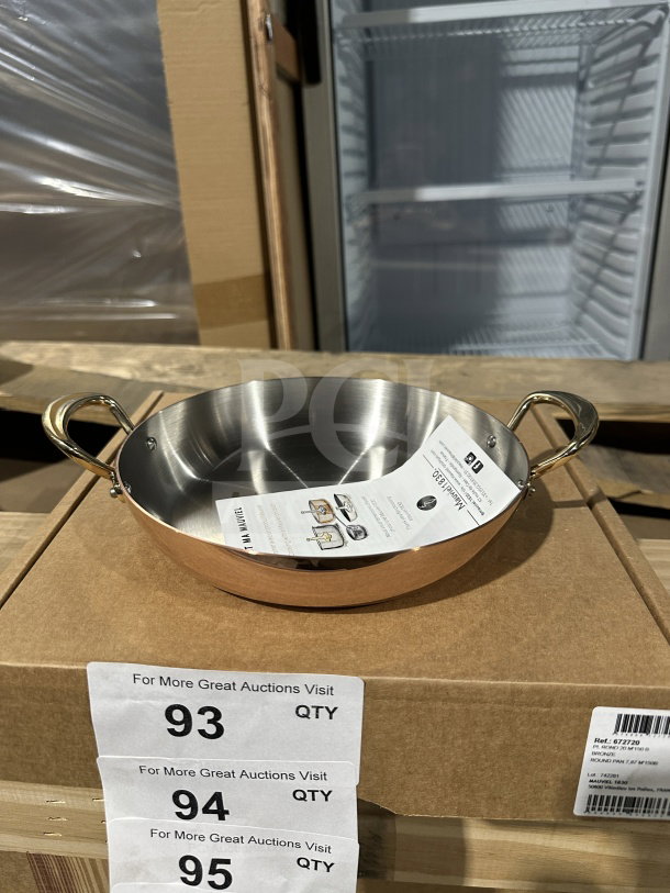 Brand new C'EST MA MAUVEL commercial bronze round pan with two handles, displayed on a box.