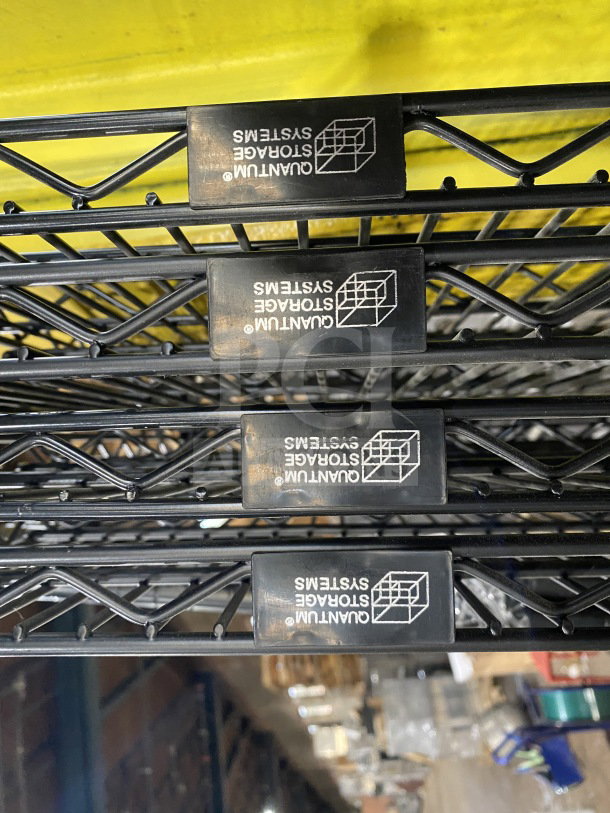 New Quantum 24x72" black carbon steel wired shelf, commercial grade, with Quantum Storage Systems logo visible.