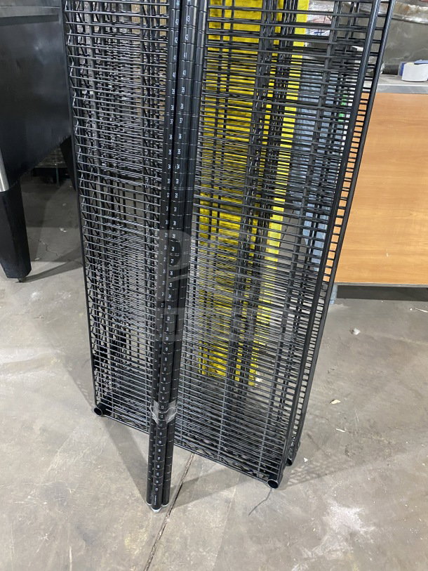 Quantum commercial carbon steel black 24x72" wired shelf, new condition. Features sturdy design and numbered posts.