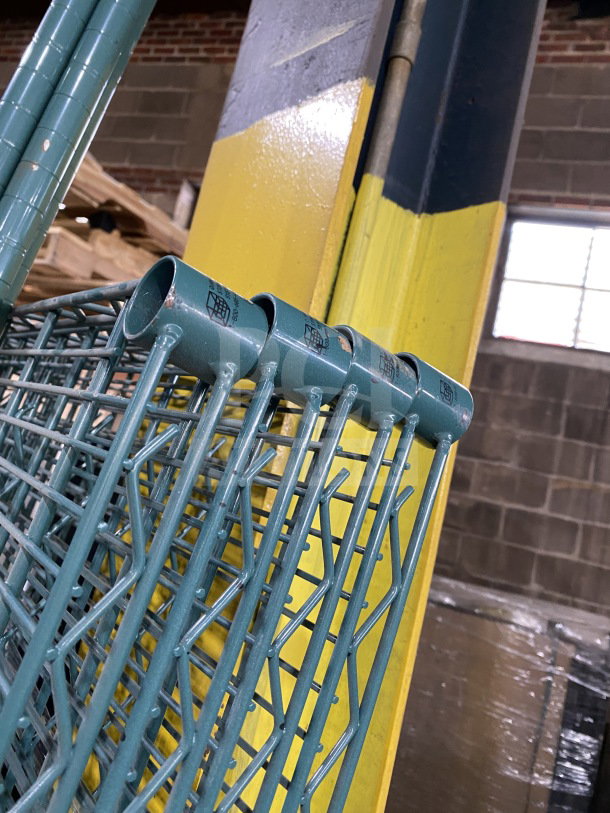 Quantum 24x72" carbon steel wired shelf in blue-gray, new condition. Features sturdy construction and protective coating.