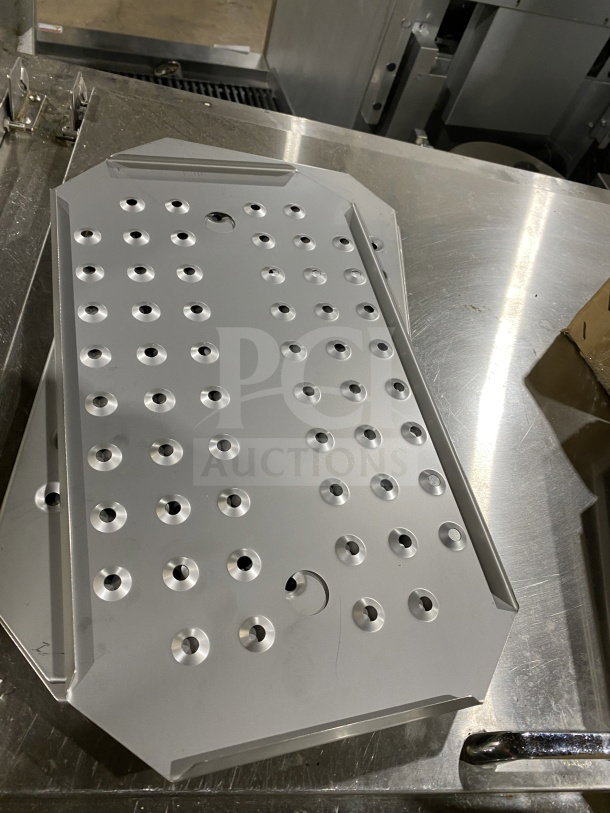 Winco stainless steel full-size steam table pan false bottom, model SPFB-1, in excellent condition, perforated design.