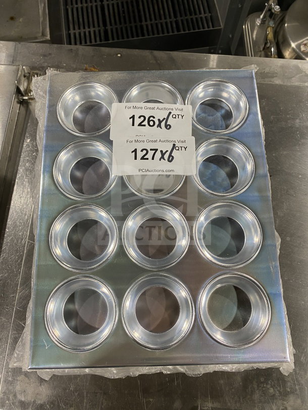 Thunder Group ALKMP012 aluminum muffin pan, 12 cups, 3.5 oz each, new condition. Tags show "126x6 QTY" and "127x6 QTY".