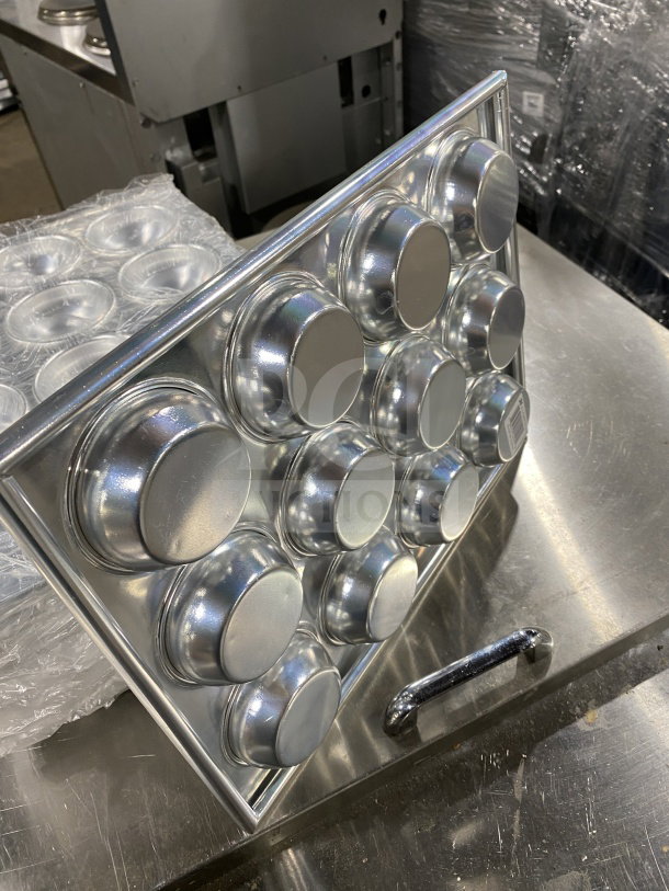 Thunder Group ALKMP012 aluminum muffin pan, 12-cup, new condition, 3.5 oz capacity per cup.