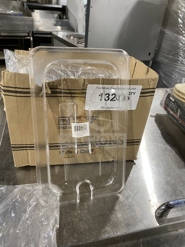Brand new Thunder Group PLPA7140CS polycarbonate food pan lid with notch and handle, shown with original packaging.