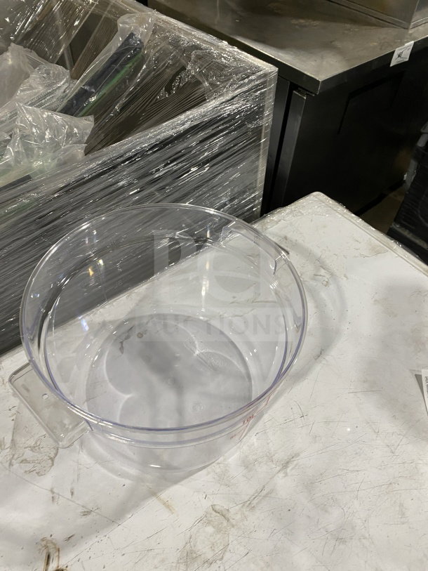 Brand new 12 Qt. clear round polycarbonate food storage container on a white surface. Durable and commercial-grade.