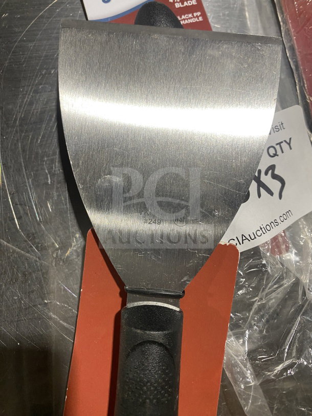 Brand new Winco Winware TKP-40 stainless steel handheld scraper with black polypropylene slip-resistant handle.